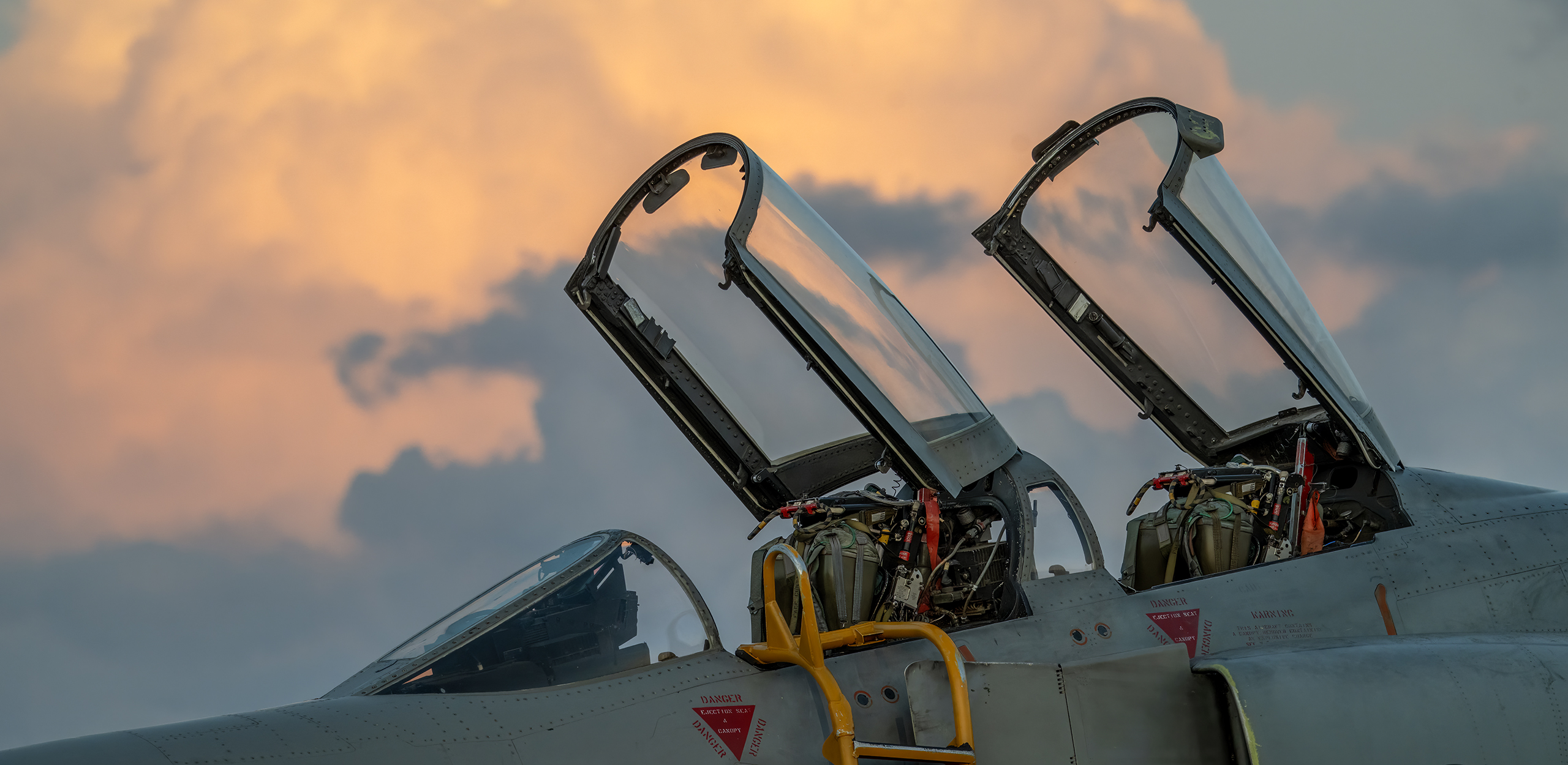 Hellenic Air Force McDonnell Douglas F-4E Phantom II with open canopies at sunset